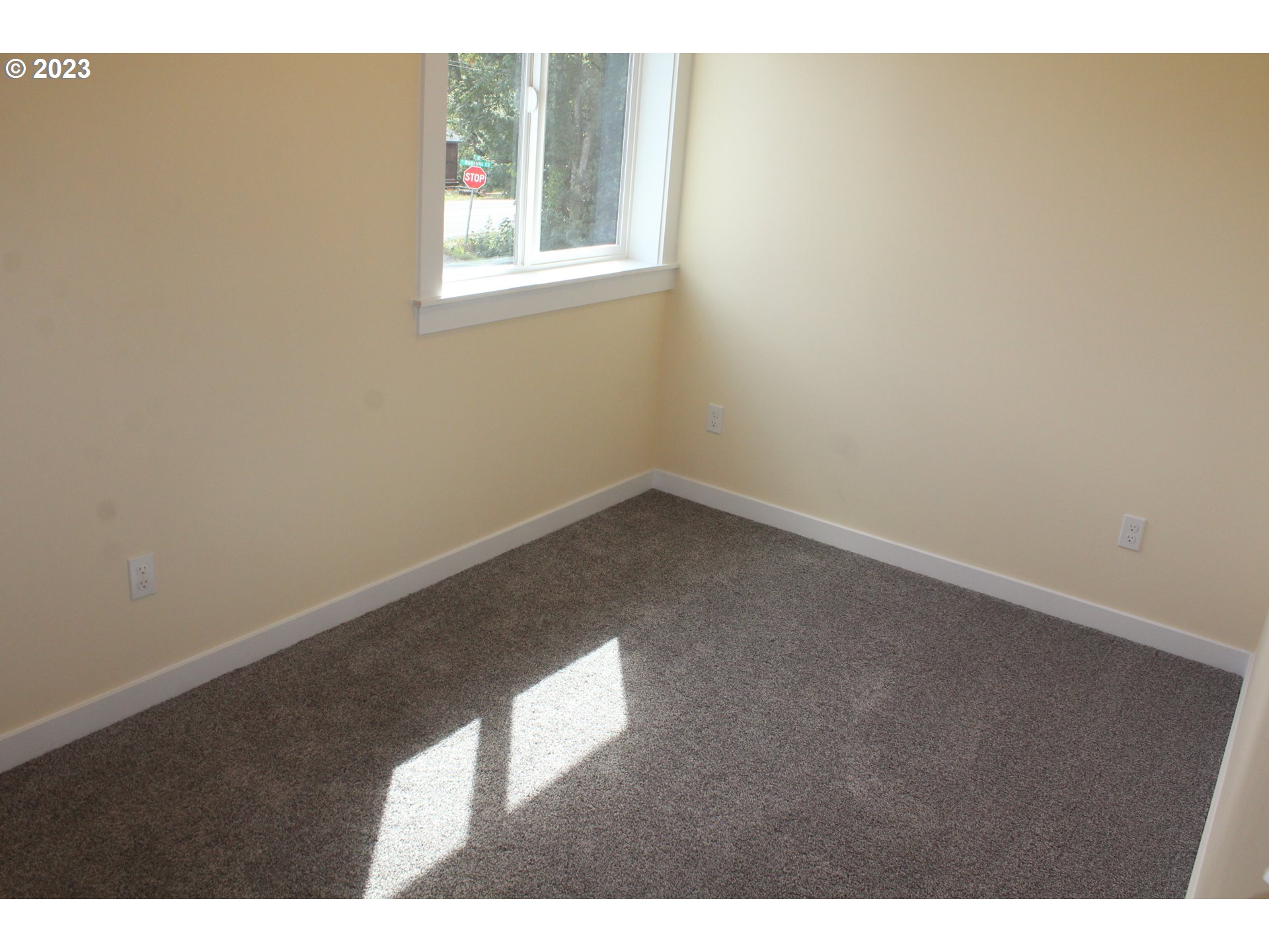 1384 10th Seaside, OR 97138 - Photo 17 of 36 a view of an empty room with a window