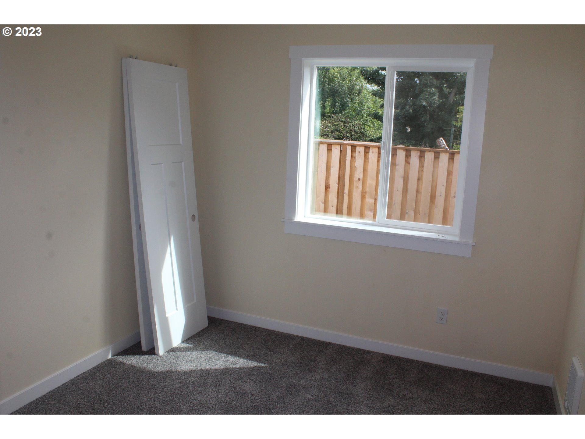 1384 10th Seaside, OR 97138 - Photo 29 of 36 a view of an empty room with a window