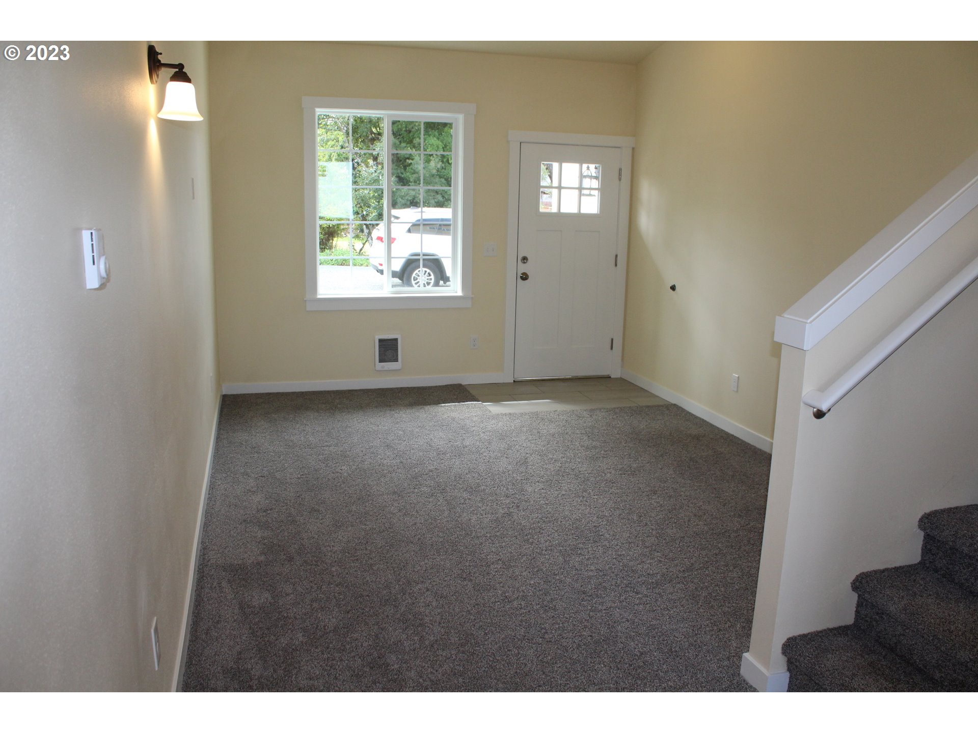 1384 10th Seaside, OR 97138 - Photo 3 of 36 a view of an empty room with a window