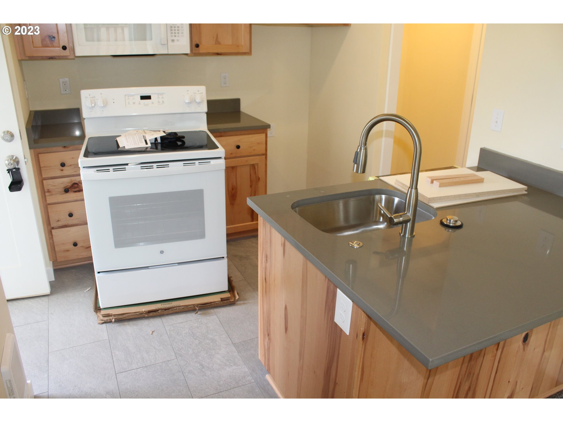 1384 10th Seaside, OR 97138 - Photo 33 of 36 a kitchen with a stove top oven and sink