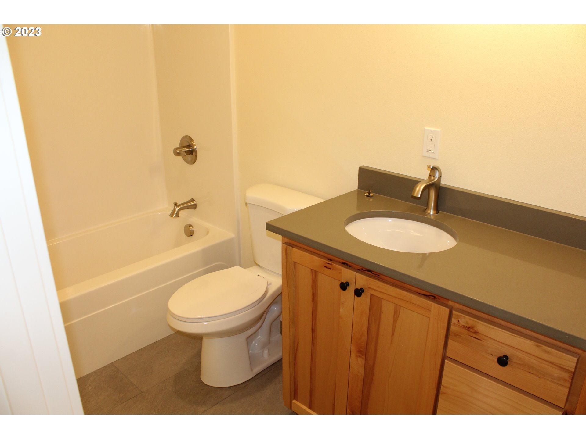 1384 10th Seaside, OR 97138 - Photo 34 of 36 a bathroom with a sink a toilet and shower