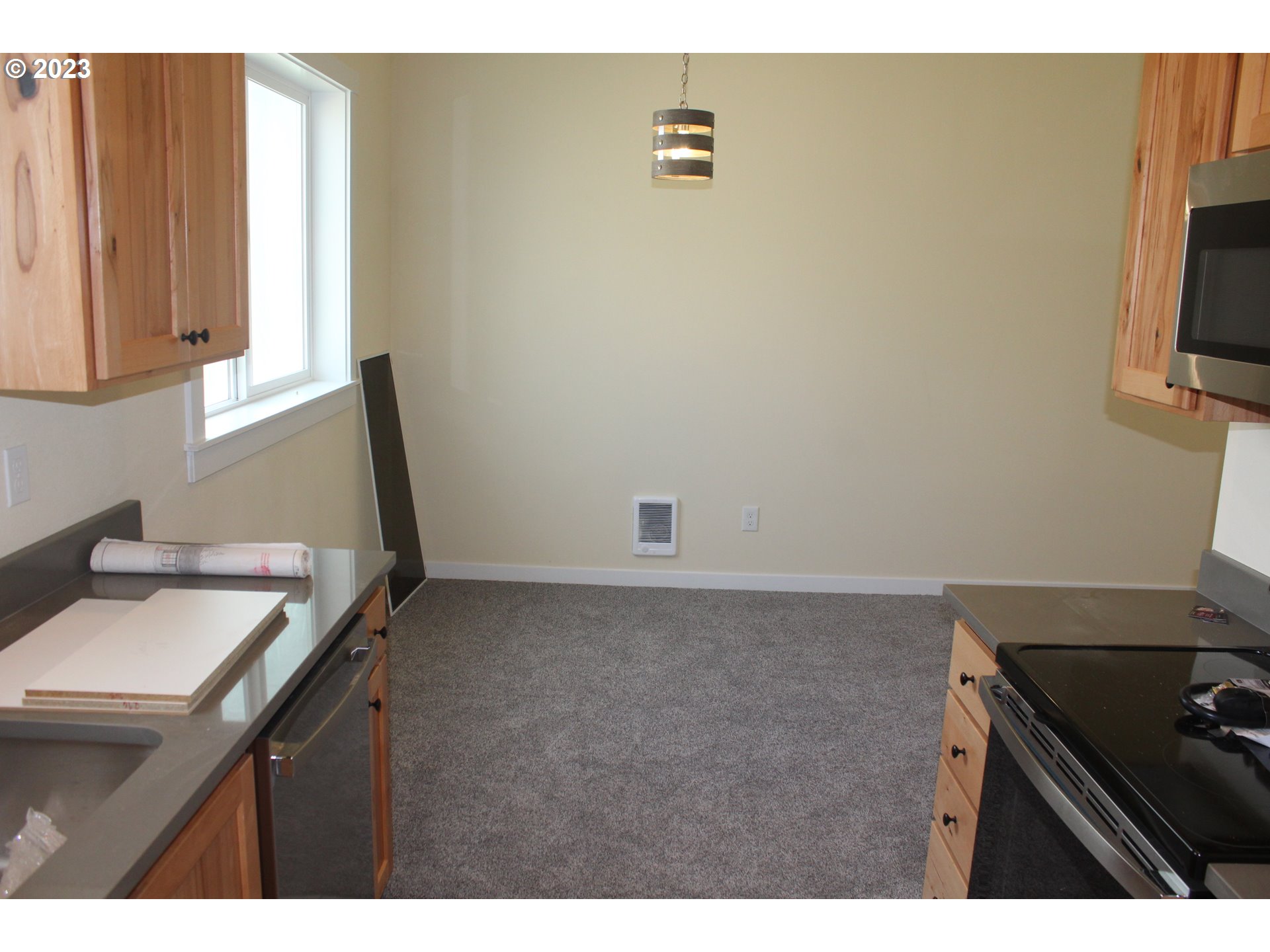 1384 10th Seaside, OR 97138 - Photo 7 of 36 a kitchen with a sink cabinets and a window