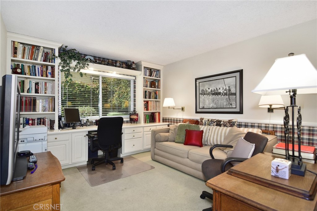 23628 Spires Street West Hills, CA 91304 - Photo 16 of 36 a living room with furniture and a large window