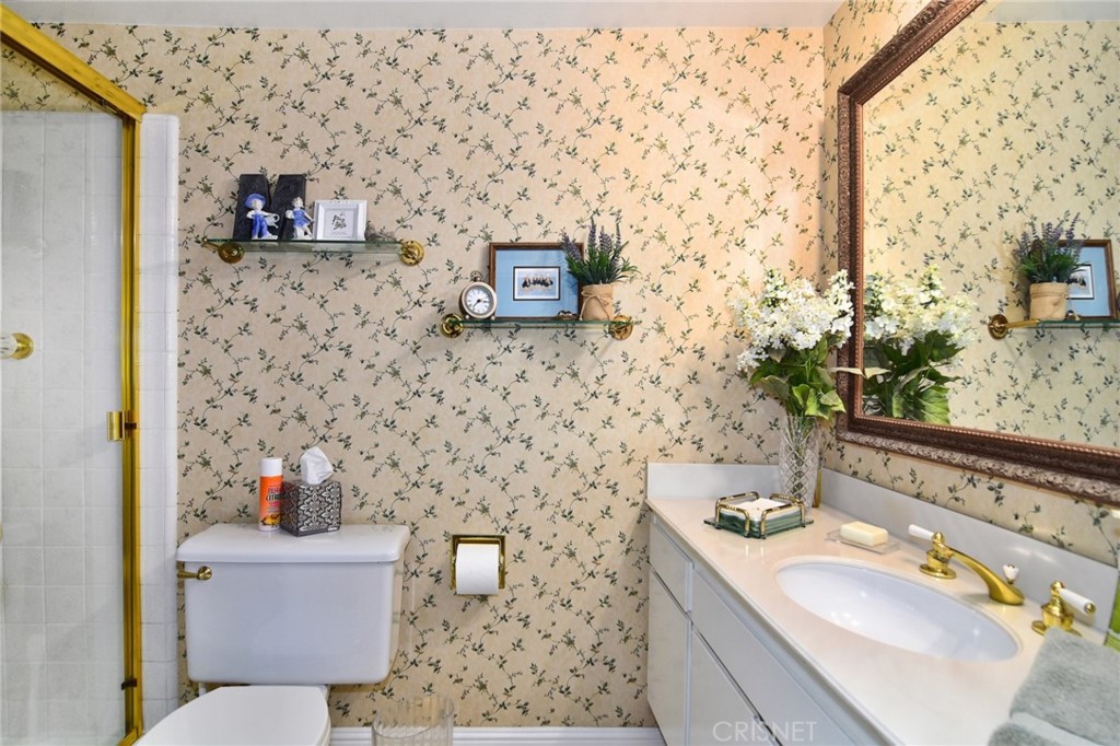 23628 Spires Street West Hills, CA 91304 - Photo 17 of 36 a bathroom with a sink and a toilet