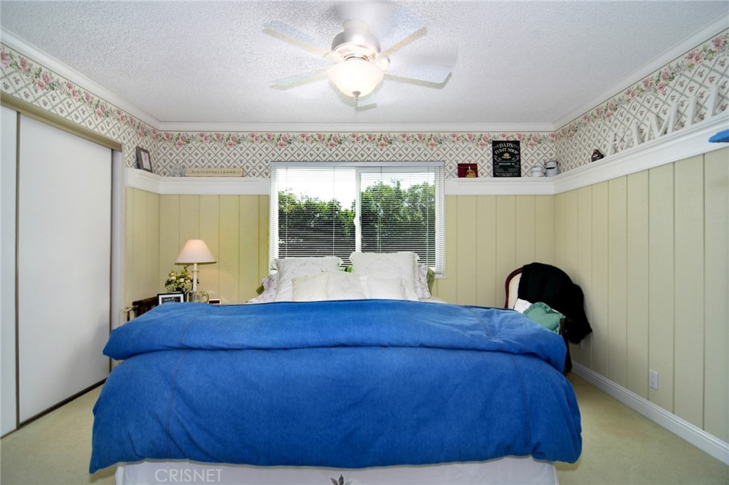 23628 Spires Street West Hills, CA 91304 - Photo 21 of 36 a bedroom with a bed and window