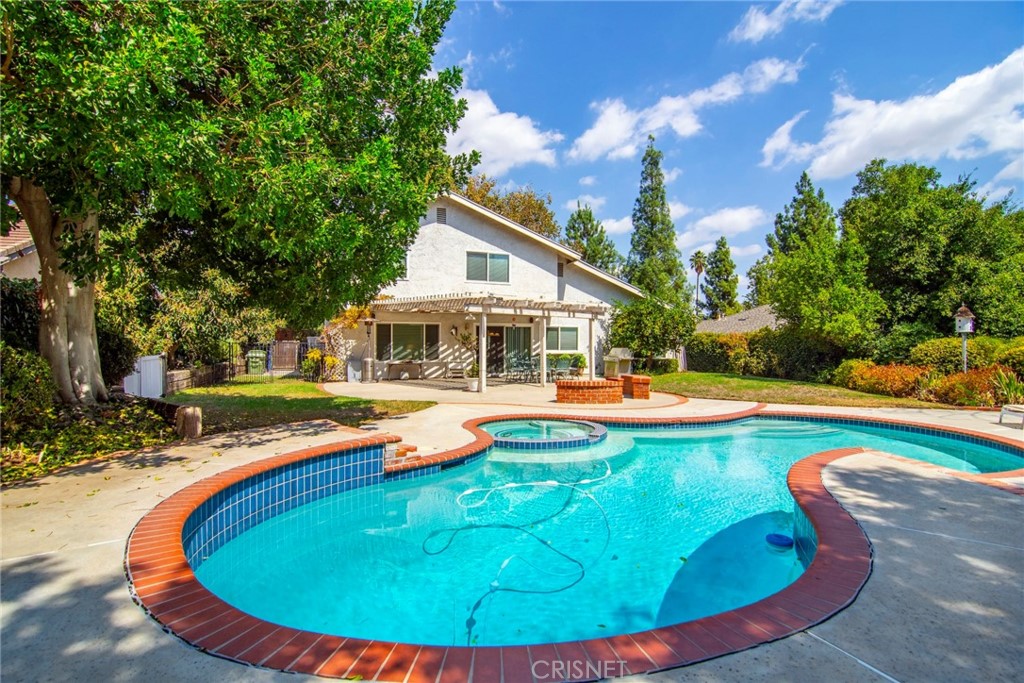 23628 Spires Street West Hills, CA 91304 - Photo 25 of 36 a view of a house with swimming pool and sitting area