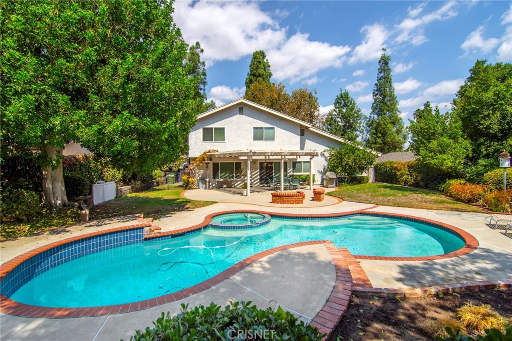 23628 Spires Street West Hills, CA 91304 - Photo 26 of 36 a view of a house with swimming pool and porch