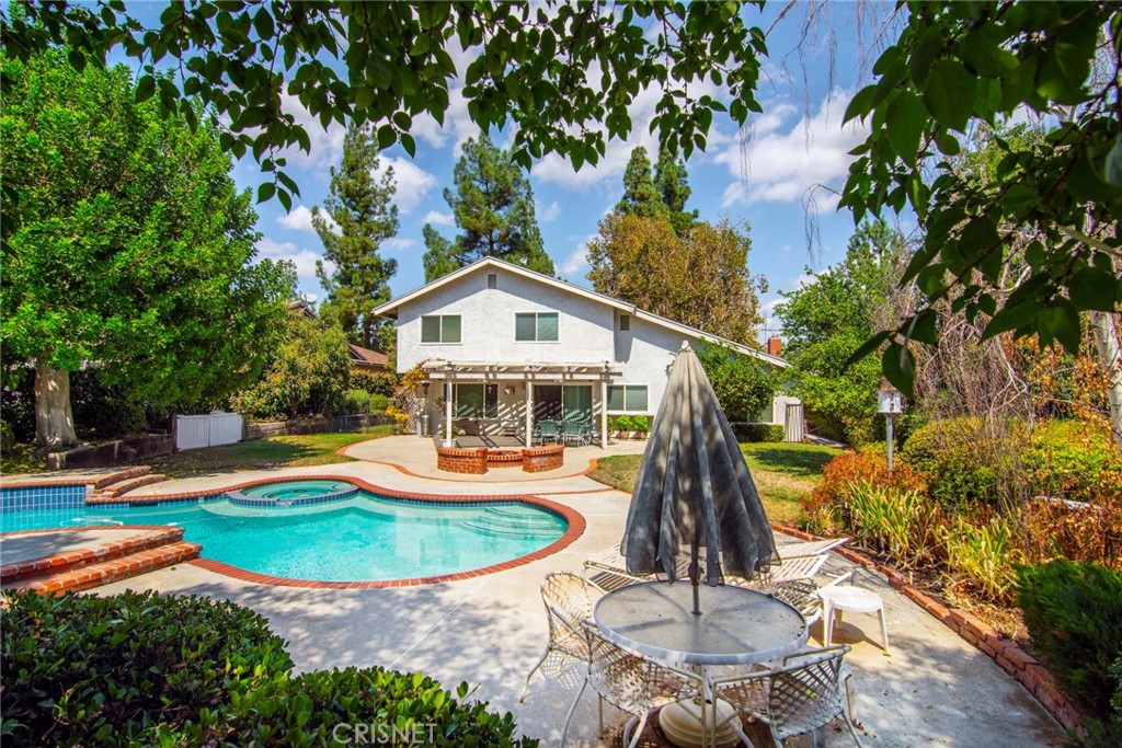 23628 Spires Street West Hills, CA 91304 - Photo 27 of 36 a front view of a house with a yard