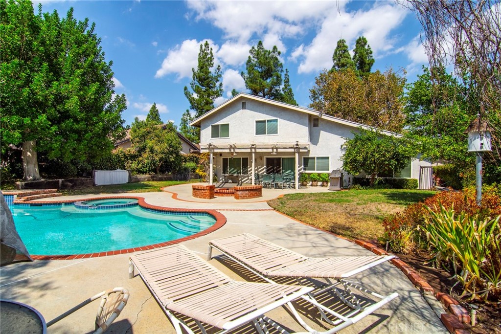 23628 Spires Street West Hills, CA 91304 - Photo 28 of 36 a view of a house with swimming pool and sitting area