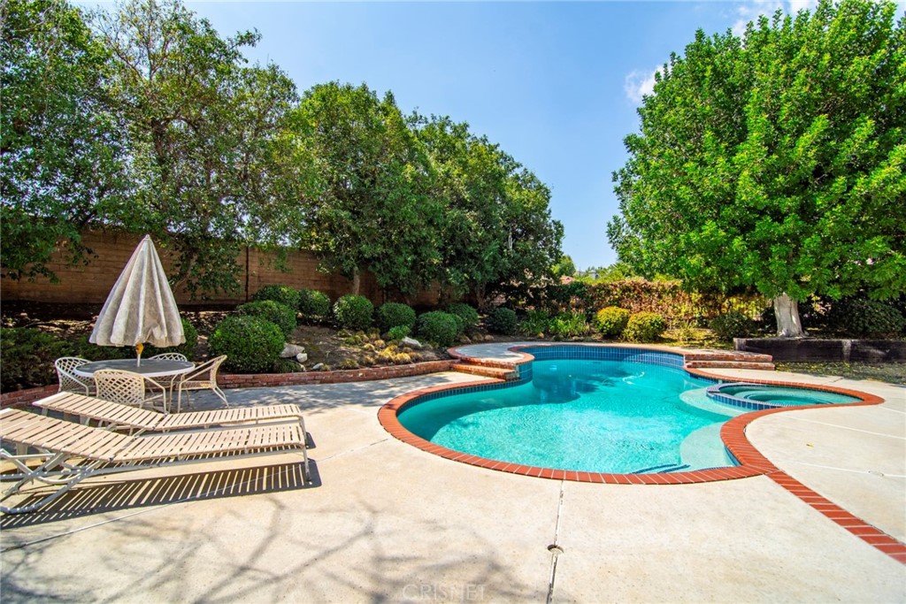 23628 Spires Street West Hills, CA 91304 - Photo 29 of 36 a view of a swimming pool with a garden