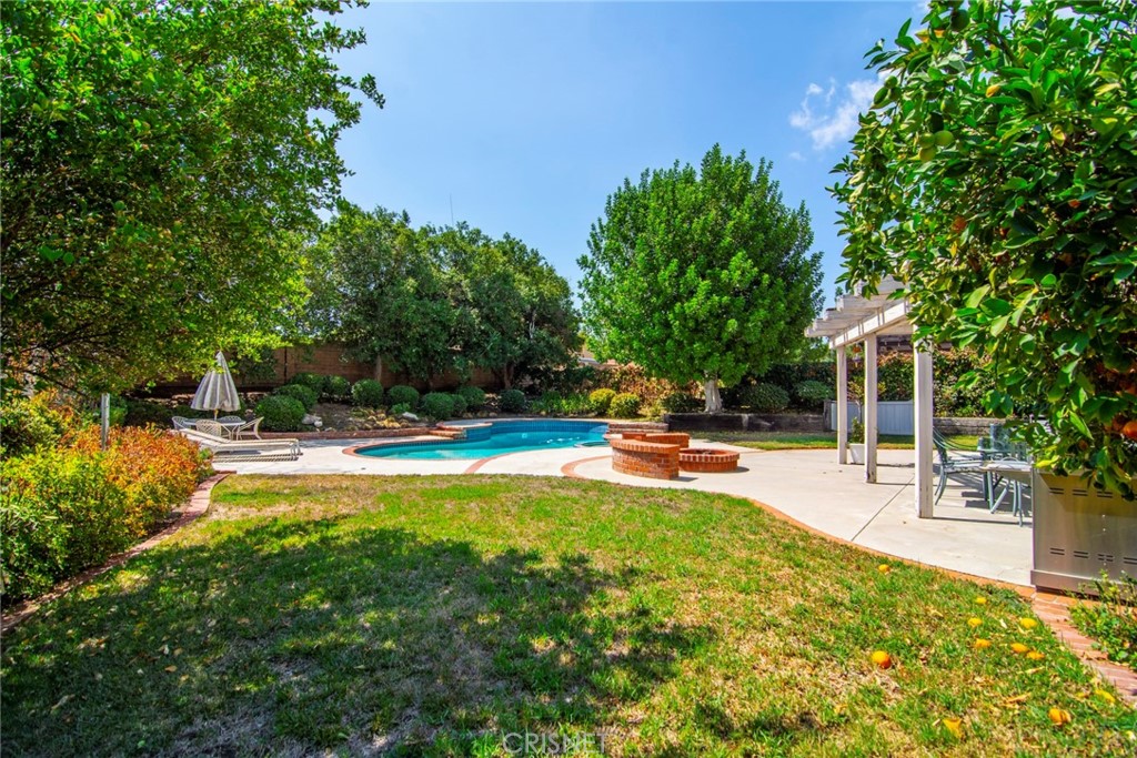 23628 Spires Street West Hills, CA 91304 - Photo 30 of 36 a view of a swimming pool with a patio