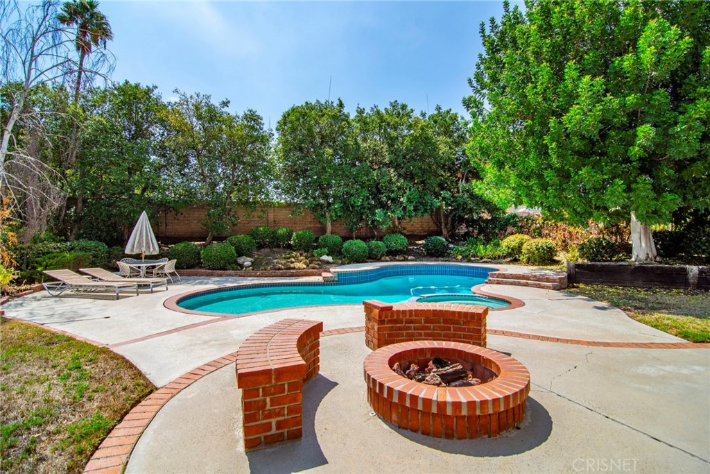 23628 Spires Street West Hills, CA 91304 - Photo 31 of 36 a view of a backyard with swimming pool and furniture
