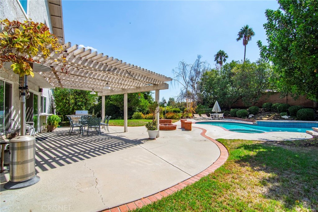 23628 Spires Street West Hills, CA 91304 - Photo 34 of 36 a view of a patio with swimming pool table and chairs