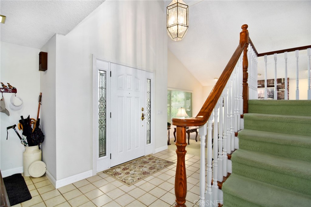 23628 Spires Street West Hills, CA 91304 - Photo 6 of 36 a view of entryway with wooden floor and stairs