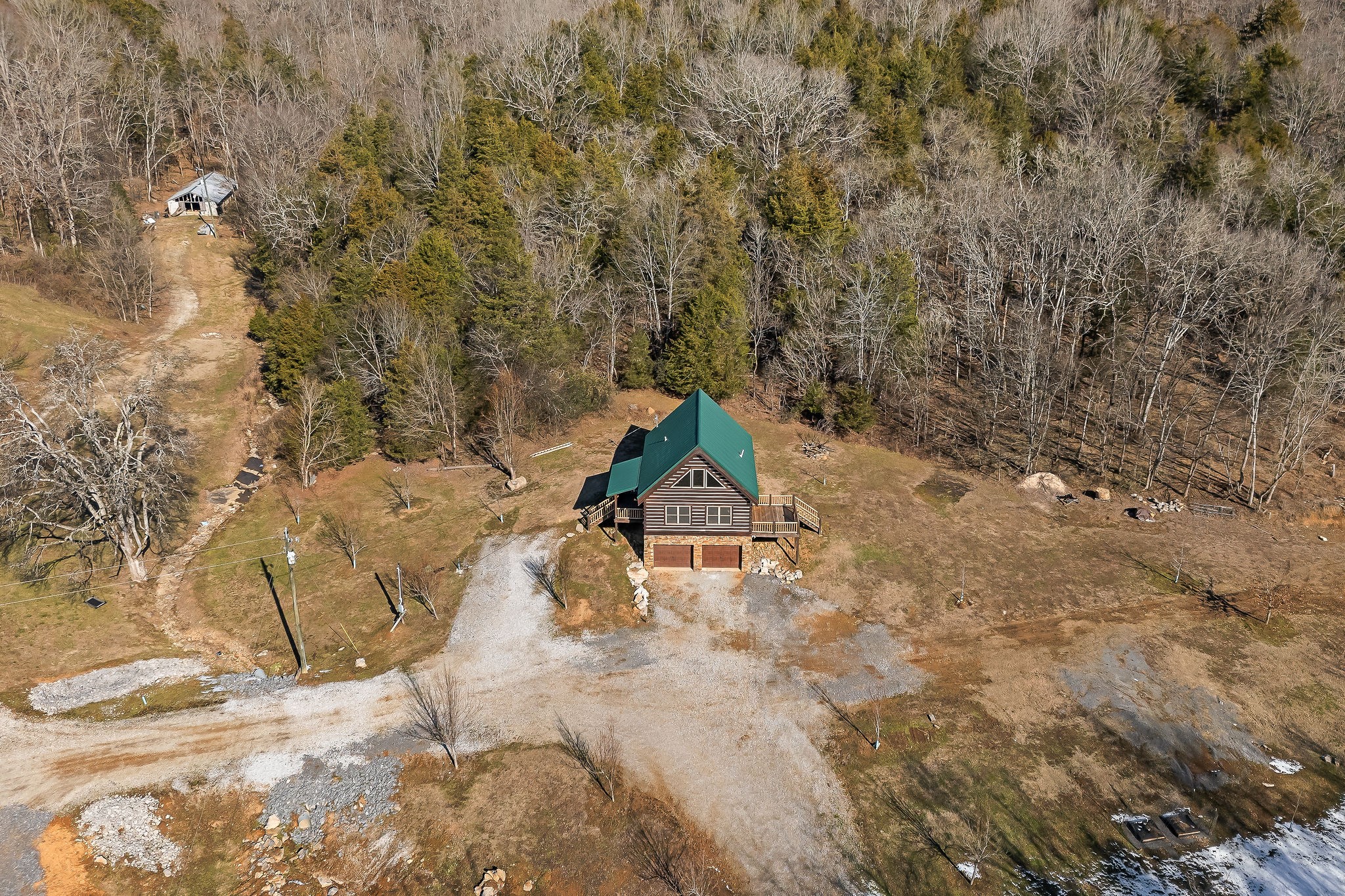 4830 Ensor Hollow Road Granville, TN 38564 - Photo 23 of 54 a backyard of a house with lots of green space