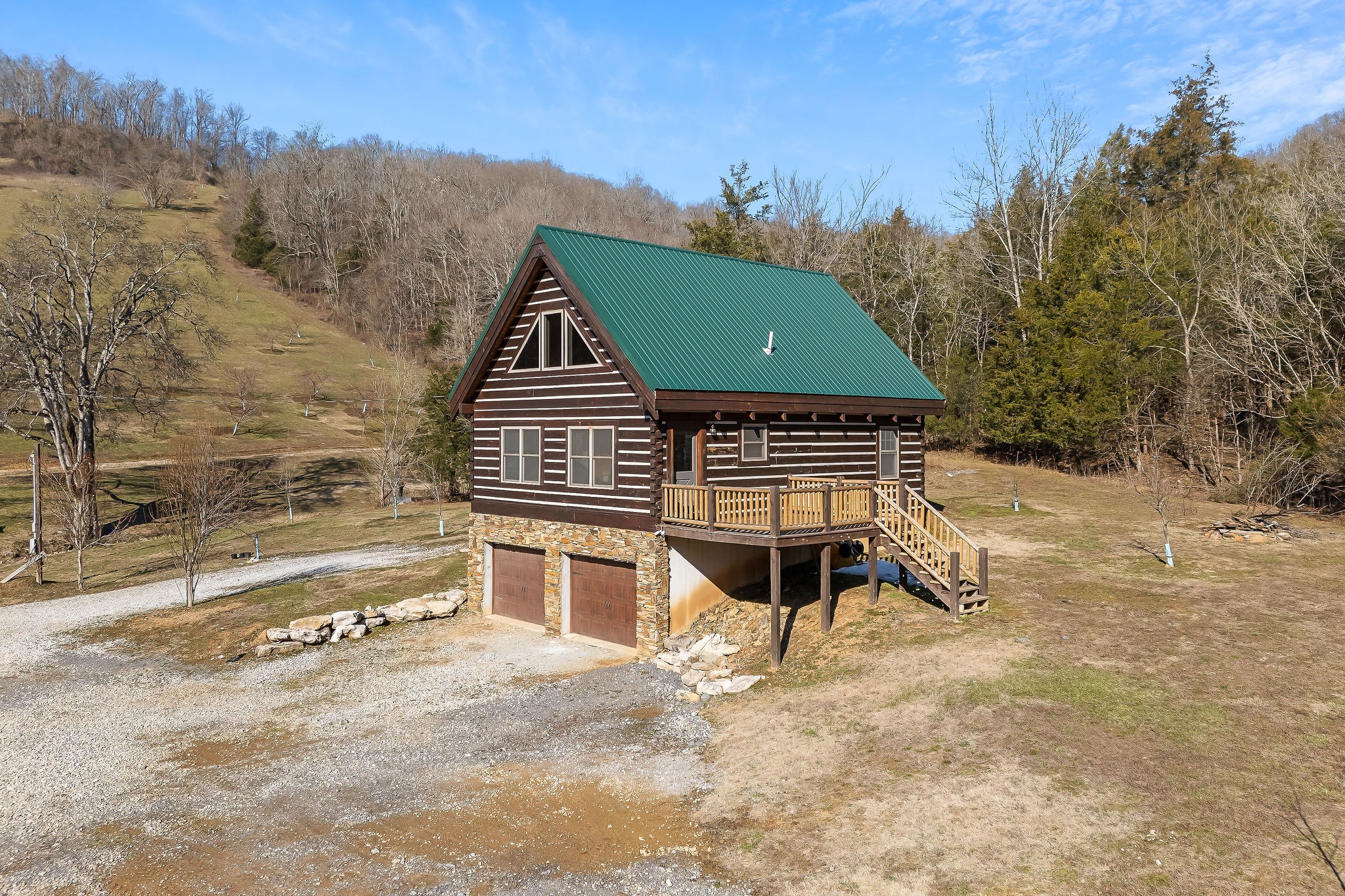 4830 Ensor Hollow Road Granville, TN 38564 - Photo 3 of 54 a front view of a house with a yard