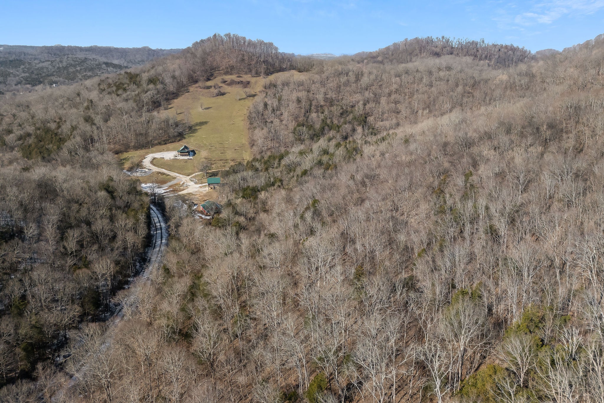 4830 Ensor Hollow Road Granville, TN 38564 - Photo 31 of 54 a view of a house with a mountain and a forest
