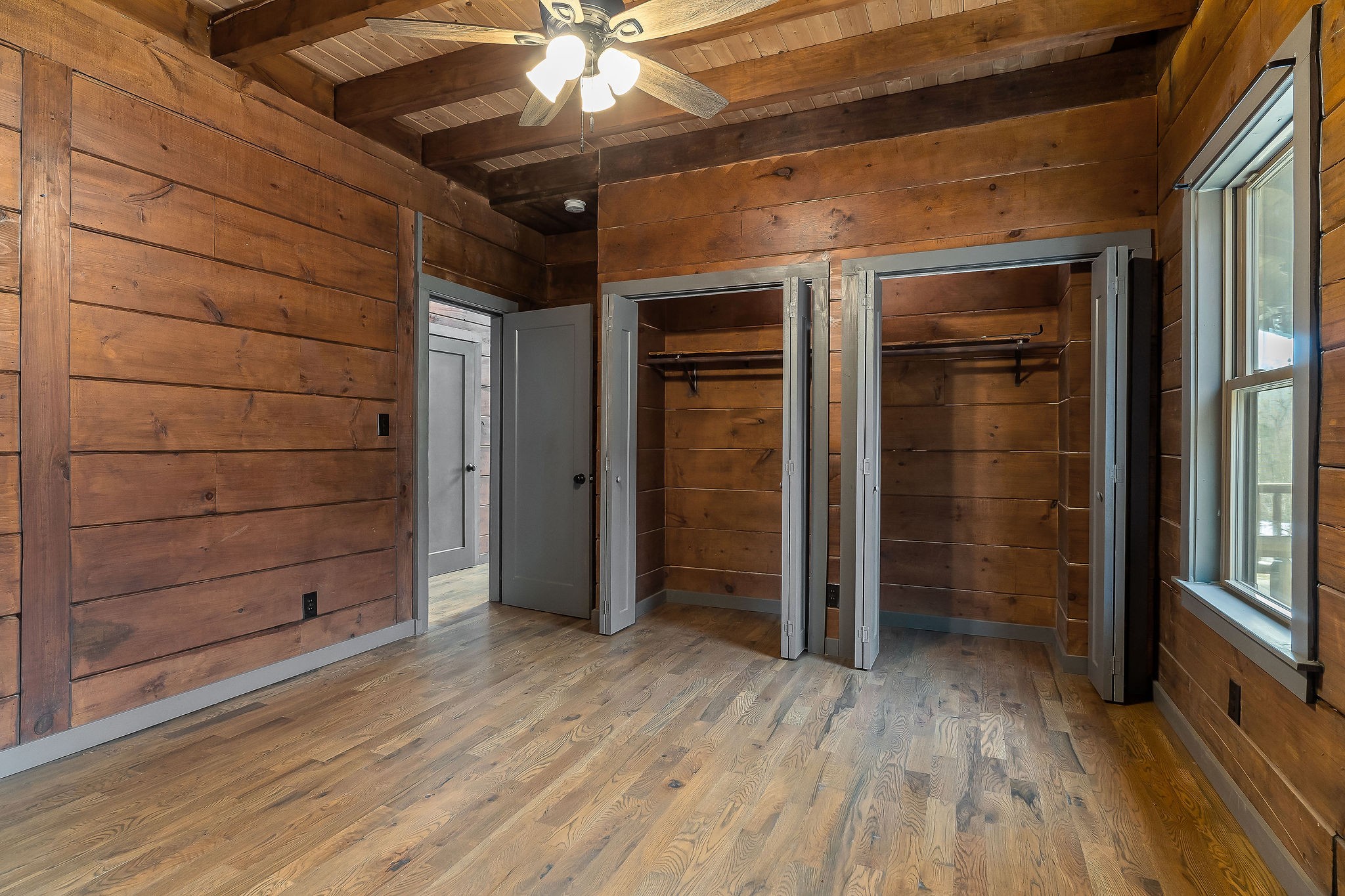 4830 Ensor Hollow Road Granville, TN 38564 - Photo 41 of 54 a view of an empty room with wooden floor and a window