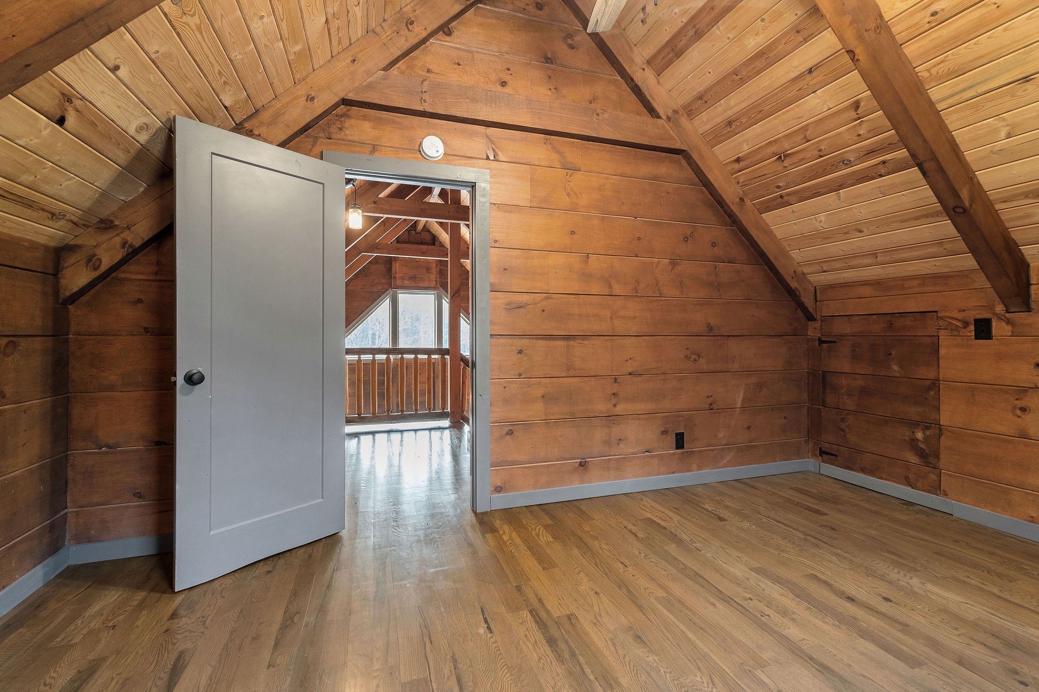 4830 Ensor Hollow Road Granville, TN 38564 - Photo 49 of 54 a view of an empty room with wooden floor and a window
