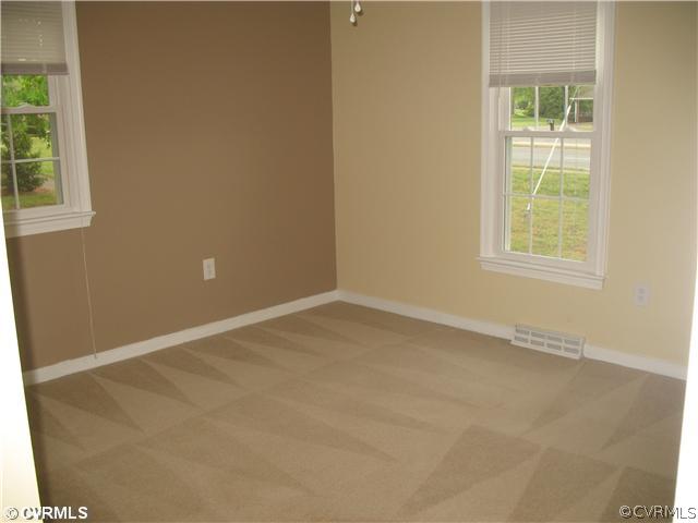 11612 Genito Road Midlothian, VA 23112 - Photo 11 of 12 an empty room with windows