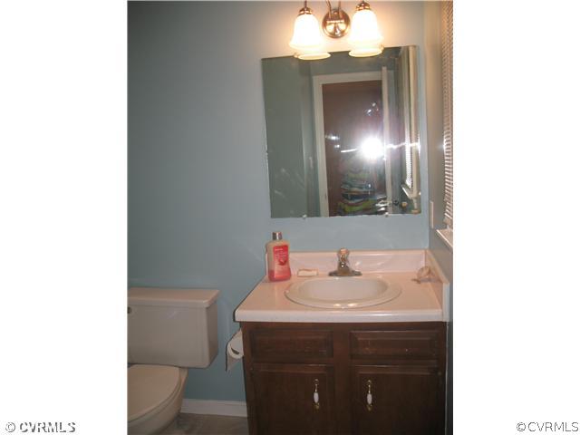 11612 Genito Road Midlothian, VA 23112 - Photo 12 of 12 a bathroom with a sink and a toilet