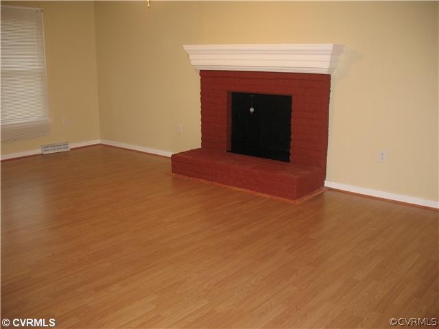 11612 Genito Road Midlothian, VA 23112 - Photo 4 of 12 a view of empty room with wooden floor
