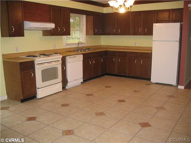 11612 Genito Road Midlothian, VA 23112 - Photo 8 of 12 a kitchen with stainless steel appliances granite countertop a stove a sink and a refrigerator