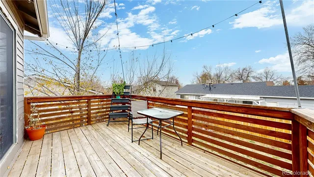 a backyard of a house with barbeque oven and outdoor seating