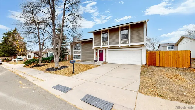 a view of a house with snow on the road