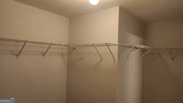 a view of a room with racks on the wall