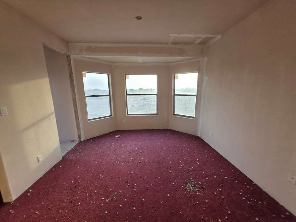 14026 Bradley Road El Paso, TX 79938 - Photo 6 of 10 an empty room that has a window