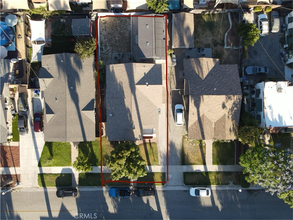 an aerial view of houses with outdoor space