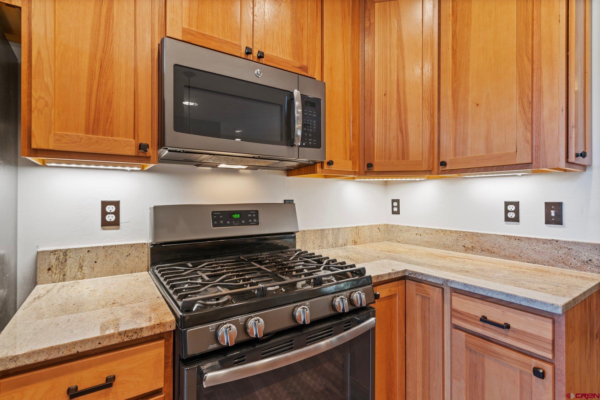 105 Window Lake Trail Durango, CO 81301 - Photo 11 of 36 a kitchen with a stove and a microwave