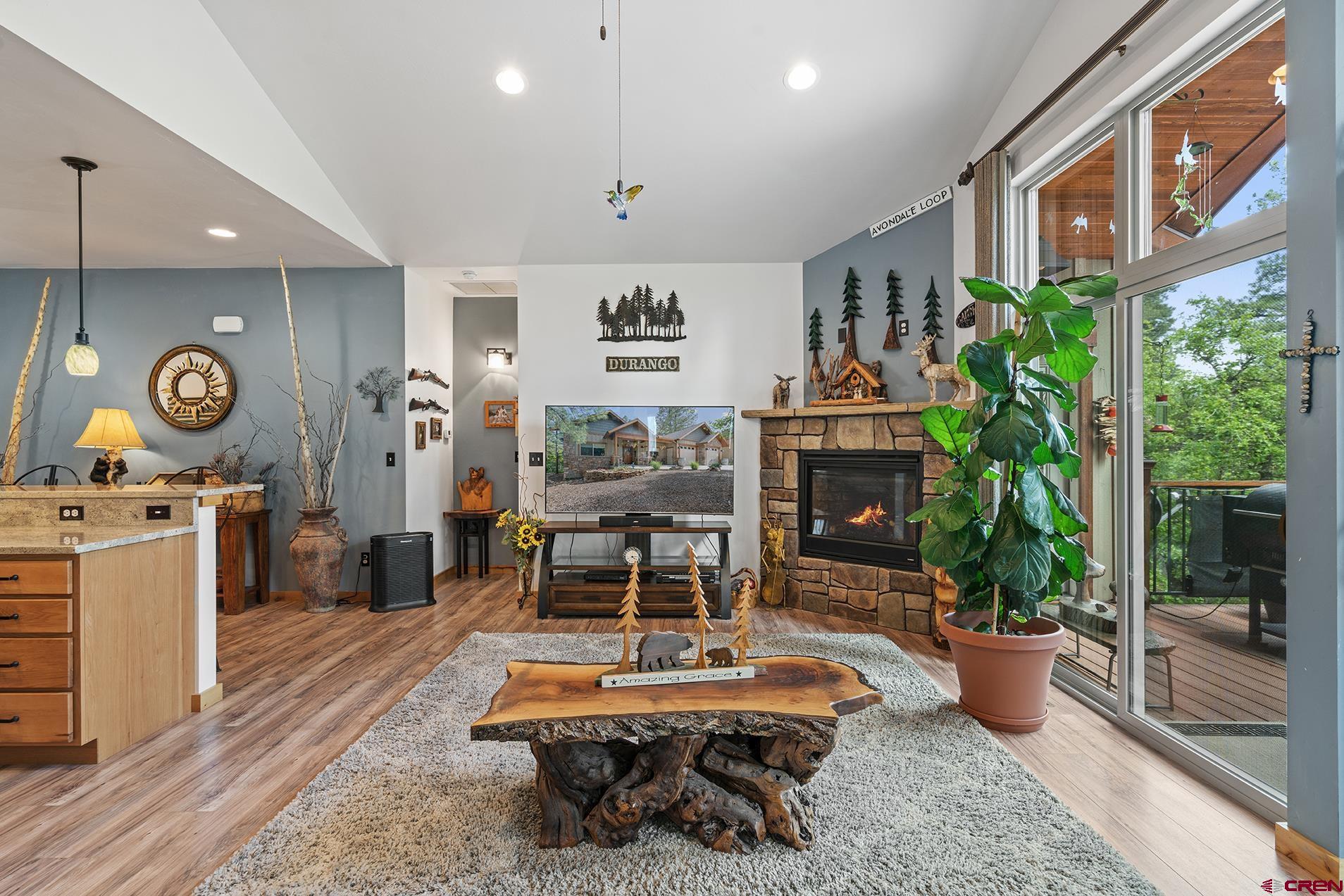 105 Window Lake Trail Durango, CO 81301 - Photo 12 of 36 a living room with furniture and a fireplace