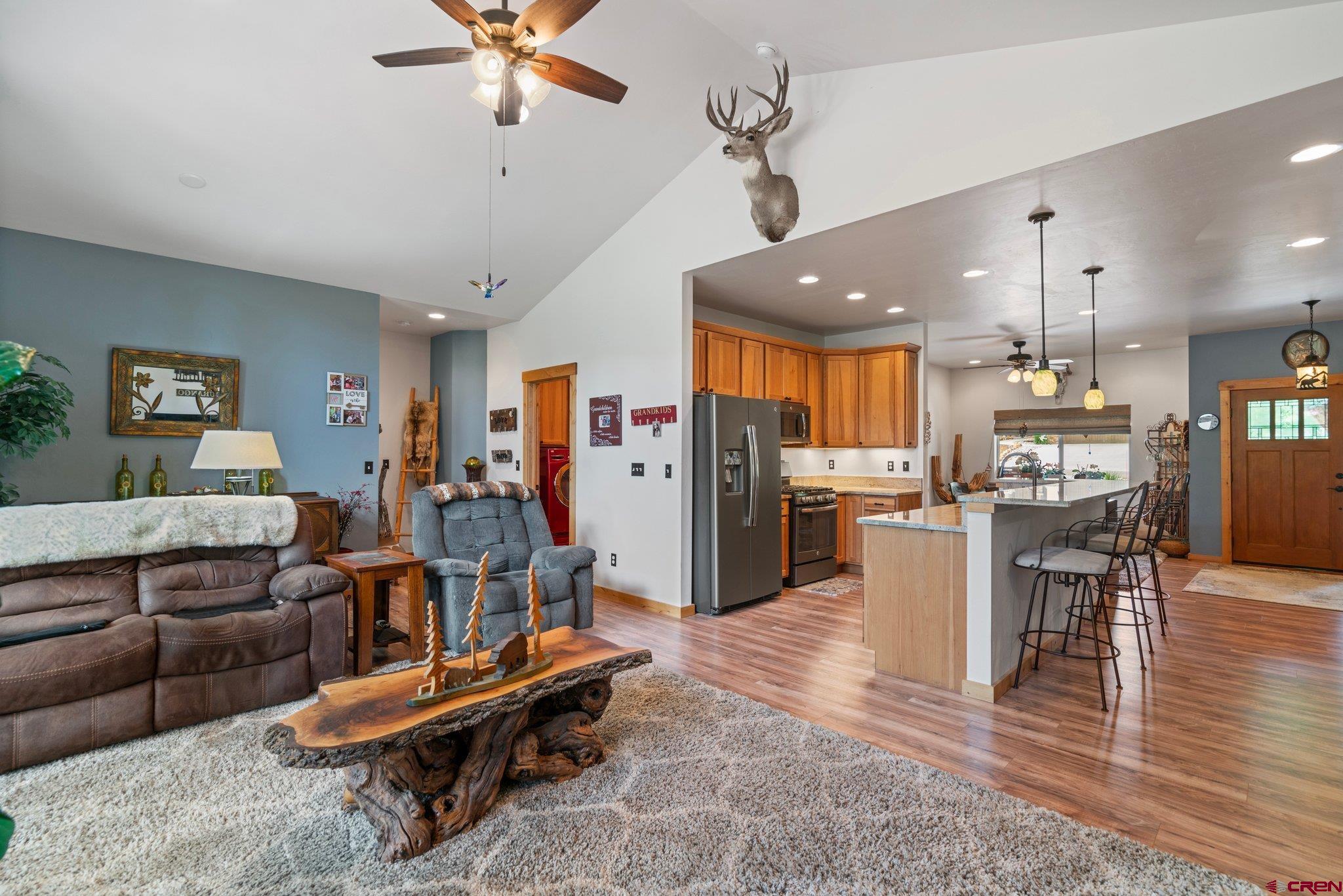 105 Window Lake Trail Durango, CO 81301 - Photo 13 of 36 a living room with furniture kitchen view and a chandelier