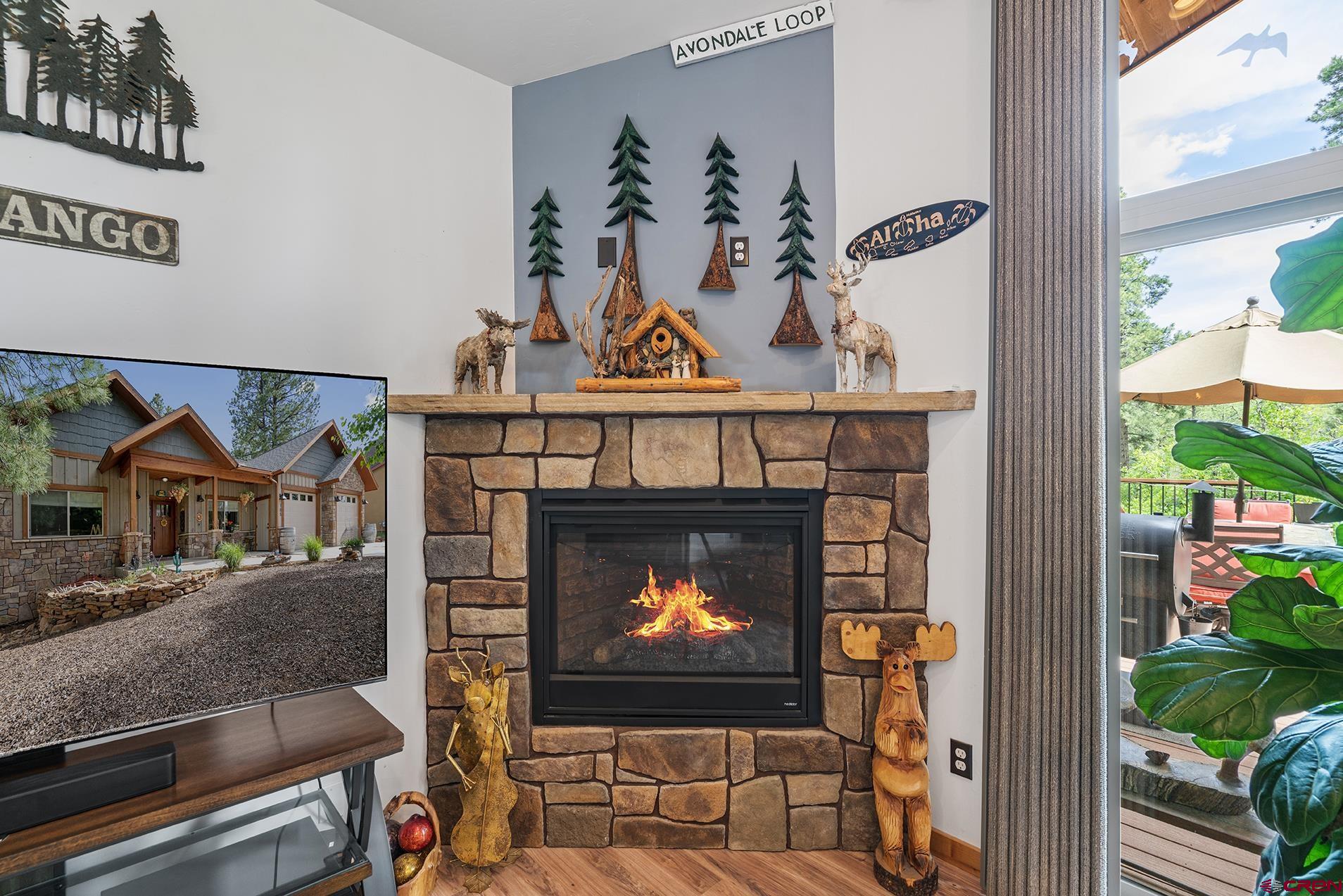 105 Window Lake Trail Durango, CO 81301 - Photo 14 of 36 a living room with a fireplace and a fireplace