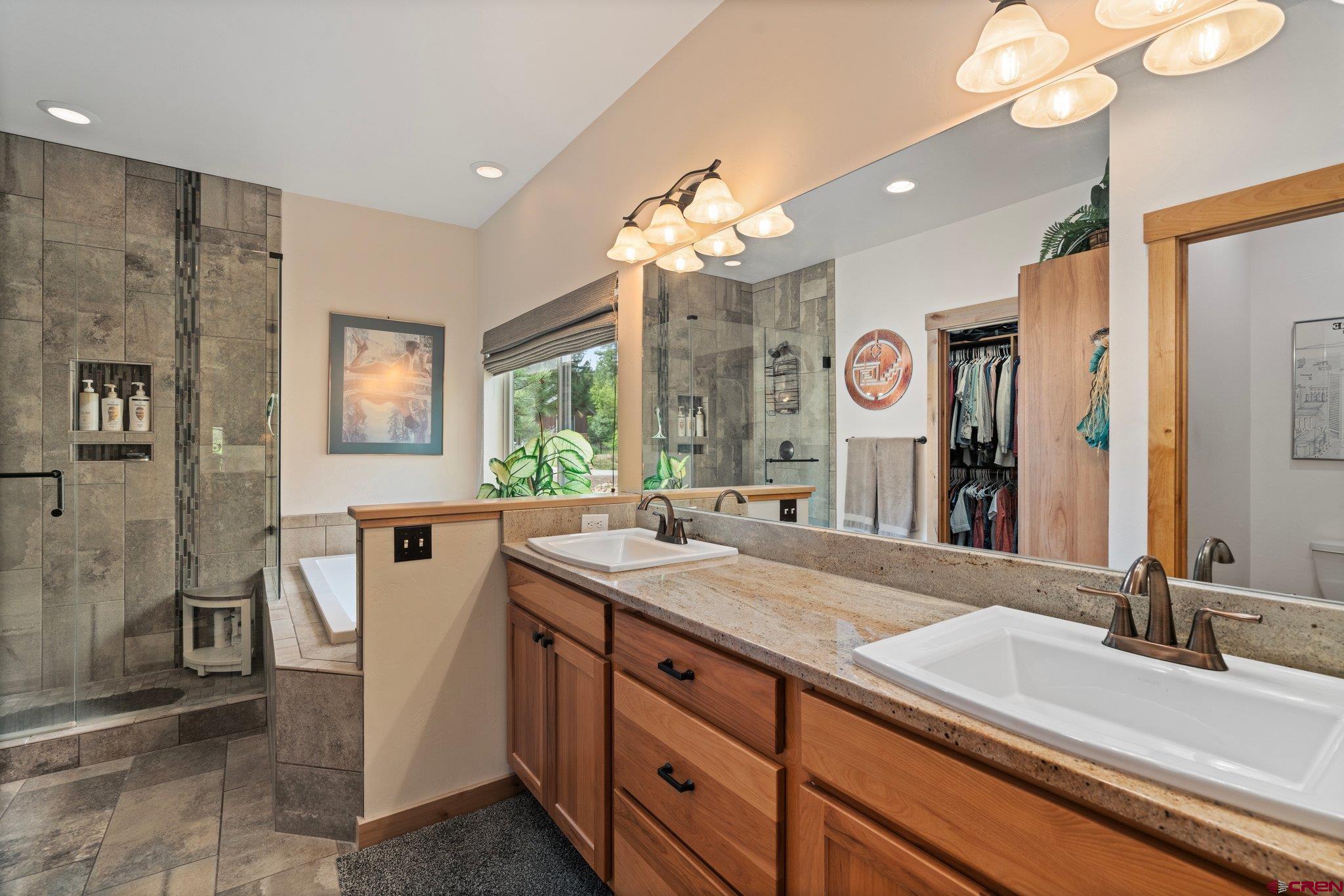 105 Window Lake Trail Durango, CO 81301 - Photo 19 of 36 a bathroom with a sink double vanity and a shower