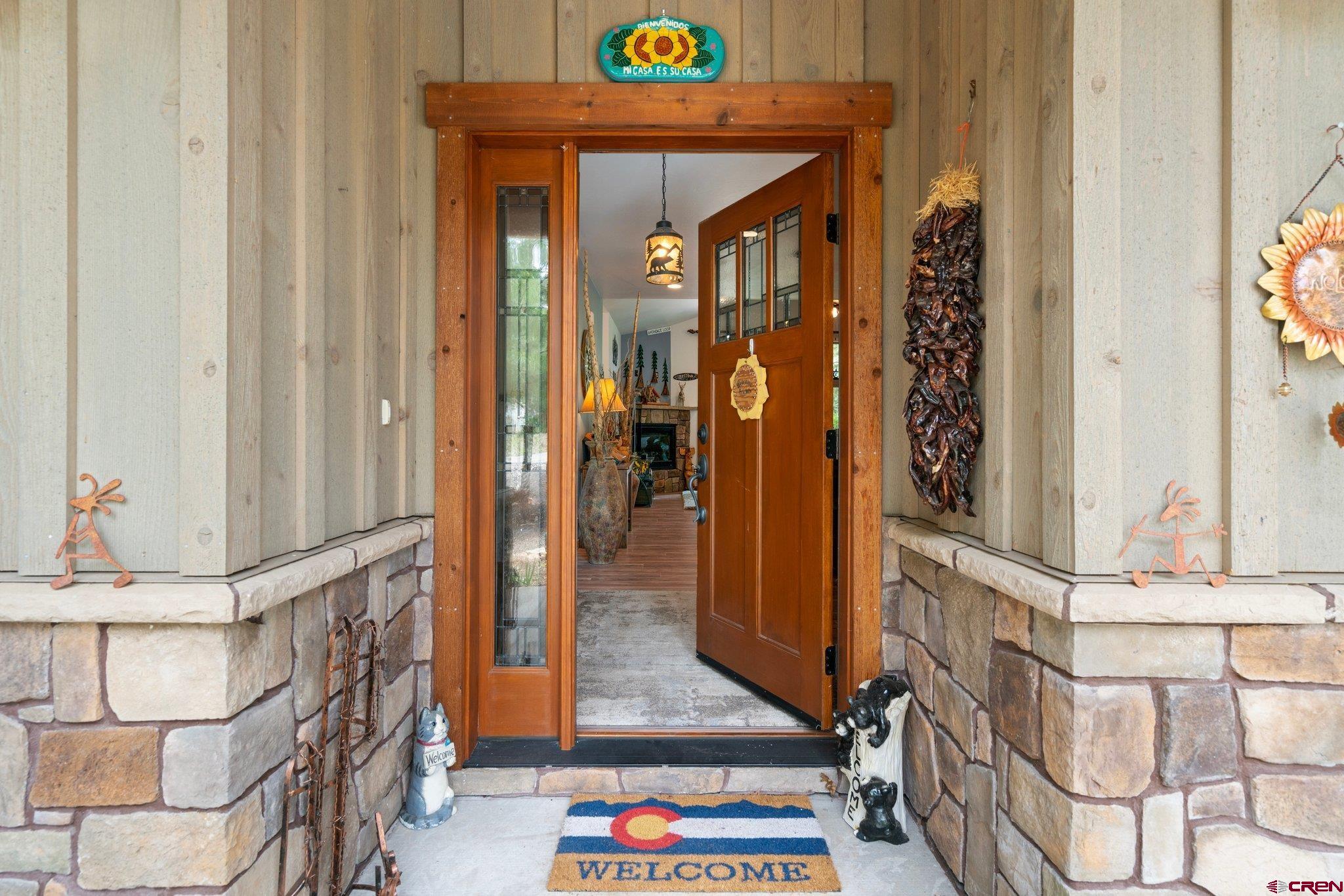 105 Window Lake Trail Durango, CO 81301 - Photo 2 of 36 a view of an entryway with wooden floor