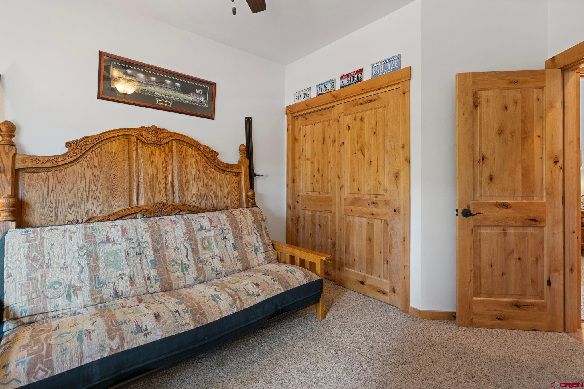 105 Window Lake Trail Durango, CO 81301 - Photo 27 of 36 a bedroom with a bed and a bathroom