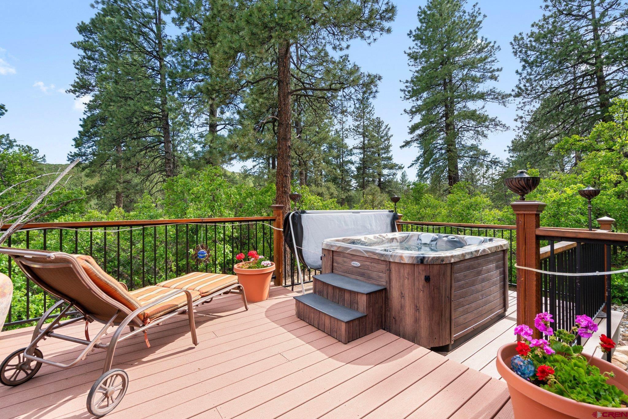 105 Window Lake Trail Durango, CO 81301 - Photo 29 of 36 a view of a deck with wooden floor and outdoor seating