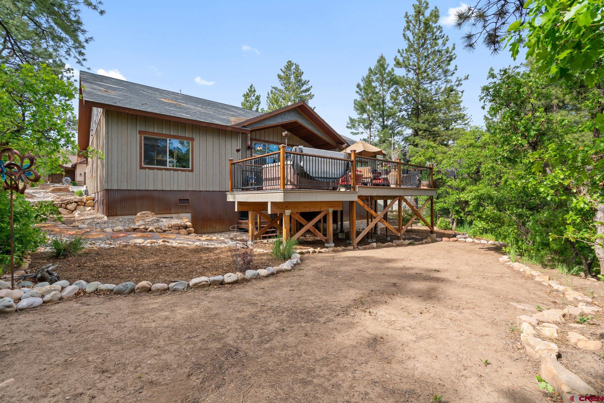 105 Window Lake Trail Durango, CO 81301 - Photo 32 of 36 a view of a house with wooden fence next to a road