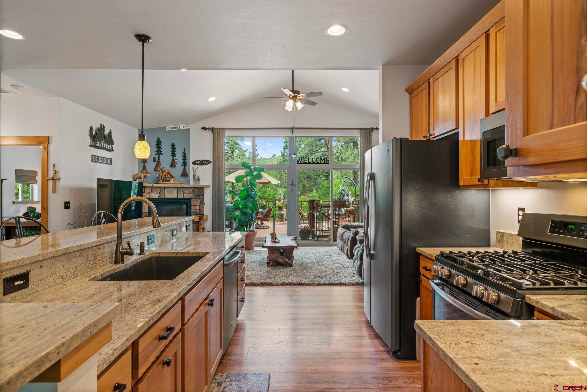 105 Window Lake Trail Durango, CO 81301 - Photo 8 of 36 a kitchen with stainless steel appliances granite countertop a sink stove and refrigerator