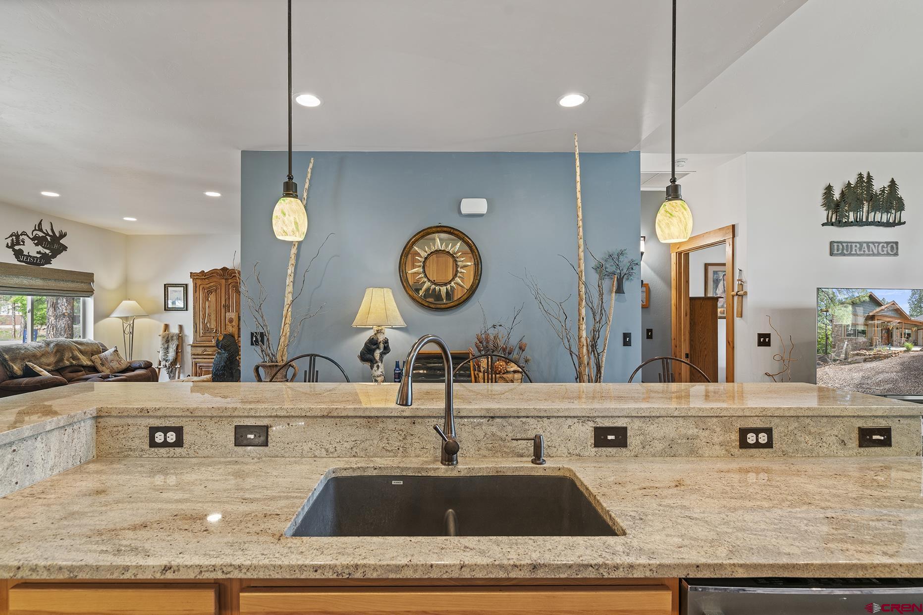105 Window Lake Trail Durango, CO 81301 - Photo 9 of 36 a kitchen with a sink and a clock on the wall