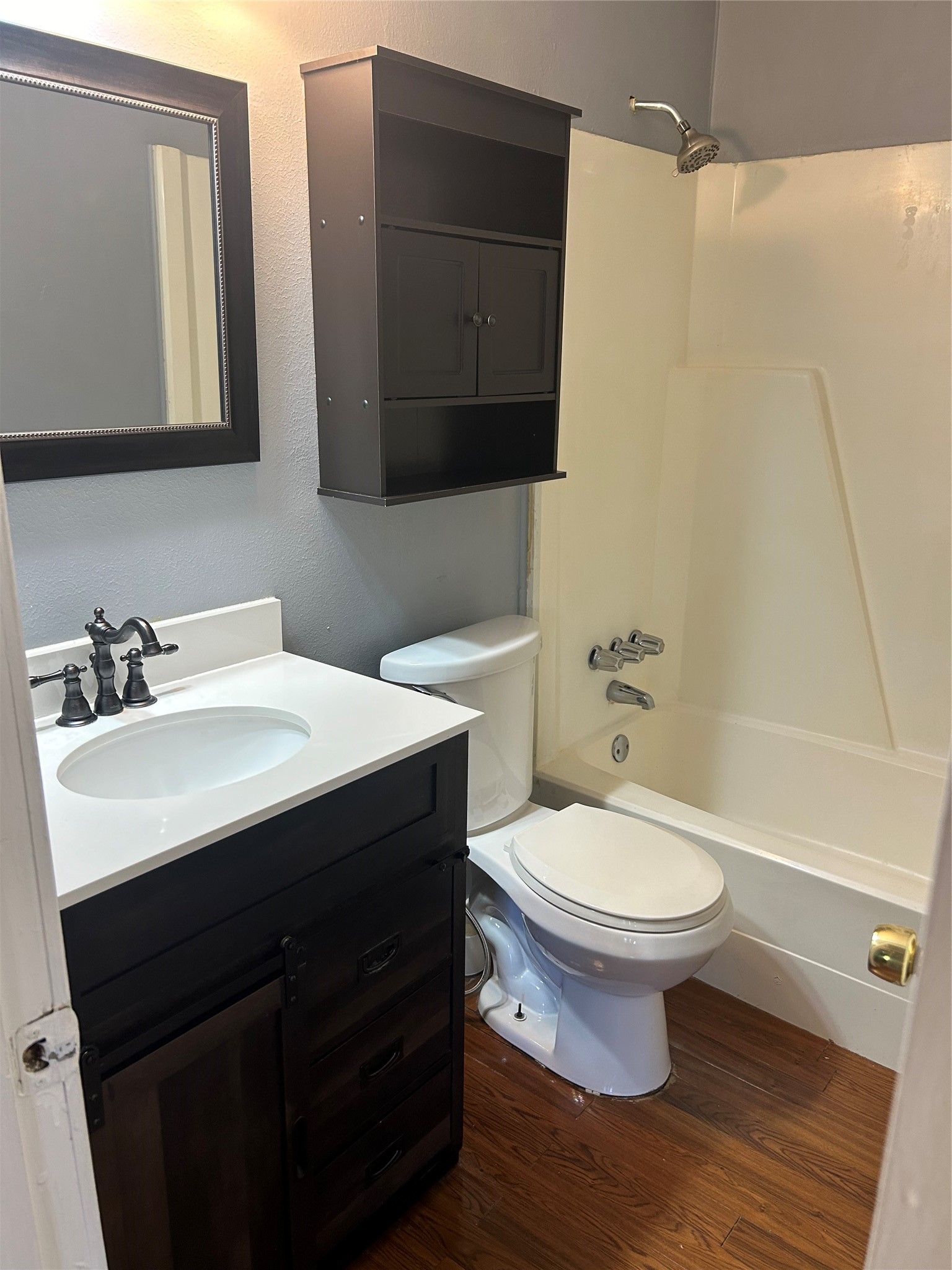 302 Arrowhead Drive Conroe, TX 77316 - Photo 14 of 23 a bathroom with a sink and a toilet