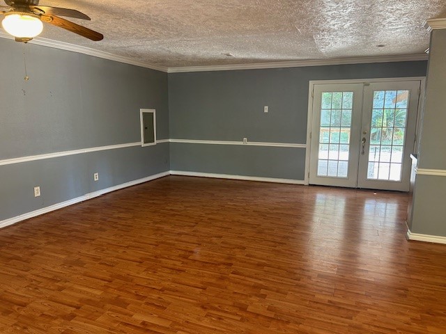 302 Arrowhead Drive Conroe, TX 77316 - Photo 18 of 23 an empty room with wooden floor and windows
