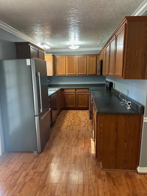 302 Arrowhead Drive Conroe, TX 77316 - Photo 21 of 23 a kitchen with a refrigerator and a sink