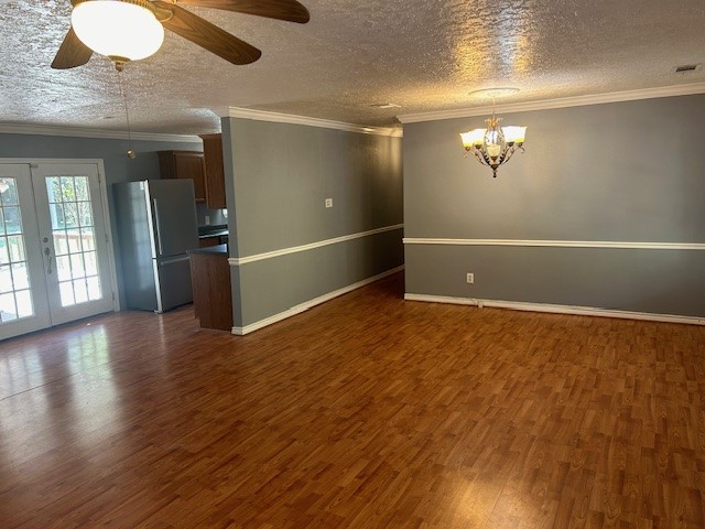 302 Arrowhead Drive Conroe, TX 77316 - Photo 22 of 23 an empty room with wooden floor and windows