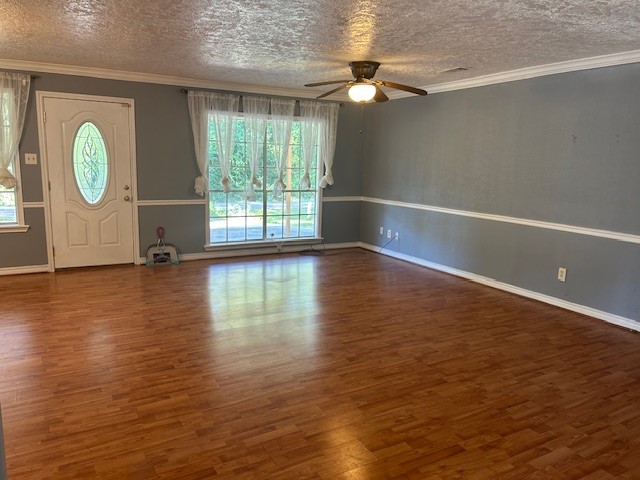 302 Arrowhead Drive Conroe, TX 77316 - Photo 23 of 23 an empty room with wooden floor and windows