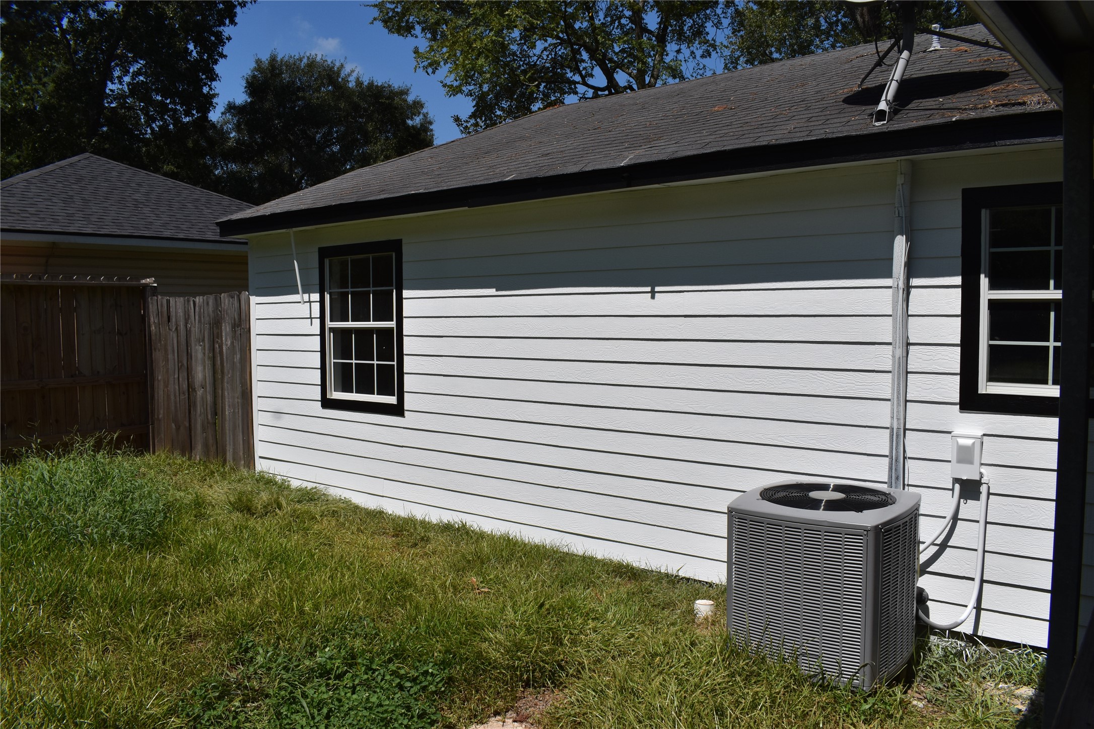 302 Arrowhead Drive Conroe, TX 77316 - Photo 10 of 23 a view of a backyard with plants and entertaining space