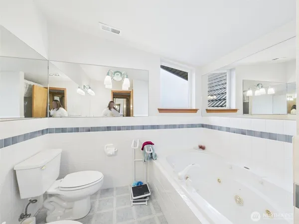 a bathroom with a sink toilet and a mirror